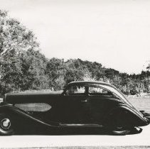 (411) 1929 Duesenberg J-212  Car 2234, left profile, woods behind