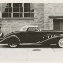 (482) 1931 Duesenberg J Convertible Coupe in front of a factory building