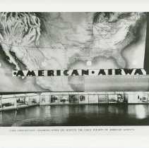 (639)1930 Duesenberg J and 4 1935 Auburns in a dealer showroom in Paris.