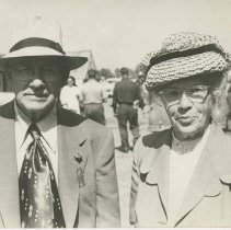 (661) Mr. and  Mrs. August Duesenberg at Indianapolis Motor Speedway, cars