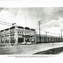 (787)1920 Duesenberg twin engine race car in front of Duesenberg Motors Co.