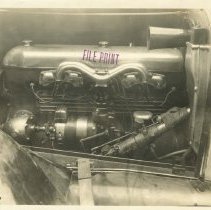 (845)1921 Duesenberg Straight 8 engine, left profile, mounted on chassis