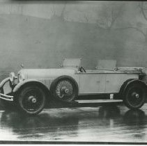 (867) 1927 Duesenberg X Dual Cowl Phaeton, hill and trees in background