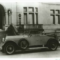 (870)1927 Duesenberg X Dual Cowl Phaeton in front of a bank or government b