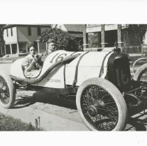 (1030)Duesenberg #16 race car with two passengers and puppy around 1916