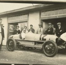 (1039)Duesenberg #12 race car with driver Peter DePaolo and many other men