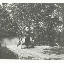 (132)1908 Chadwick Race Car, driven by Willie Haupt, on a rural, dirt road