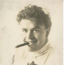 (141)Portrait of Tom Alley, cigar in mouth, around 1915