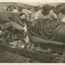 (149)Two shots of Joe Boyer's wrecked 1924 Duesenberg Race Car