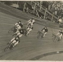 (173)Several bicyclists in a race on Board Track, Peter DePaolo is in 2nd