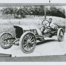 (76)1910 Mason Race Car #31 with driver Harry Endicott in woodsy setting