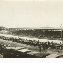(384)Main straight away with cars & spectators at Indianapolis MSW