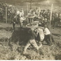 (458)Overturned 1914 Duesenberg Race Car #5, Augie Duesenberg in shot