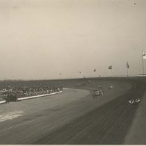 (486)Race cars in action at track in Beverly Hills, CA, country flags