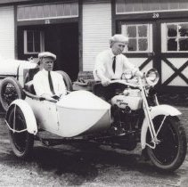 (504)Jimmy Murphy & Ernie Olsen in Harley Davidson motorcycle at race track