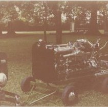 Bill Bocock's Duesenberg Engine on stand at Eckhart Park, Auburn, Indiana