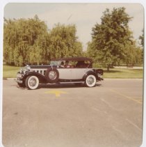 1930s Cadillac convertible in a parking lot