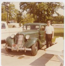 1936 Auburn 654 brougham with an Unidentified man in a parking lot