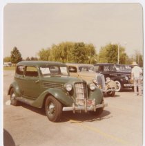 1936 Auburn 654 brougham in a line with other cars in a parking lot
