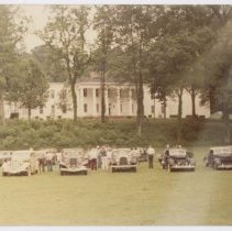 Auburns and Cords in front of white house on Lawn centered.
