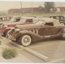 Front of three Auburns, a replica speedster is in the forefront