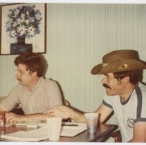 Jack Randinelli with anunidentified man lin a light blue room