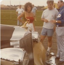 Festival goers around a Packard
