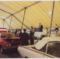 Kruse auction tent, several cars lined up in front