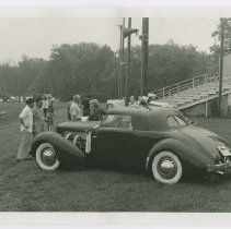 Cord 810/812 on grass besides bleachers.