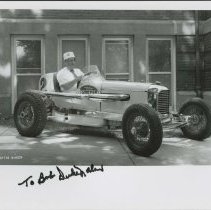 #2 Dreyer race car with unidentified individual sitting in it.