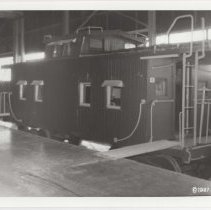 1987 black and white photo of a train caboose