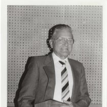1988 black and white photo of Frank Schmitz holding his award plaque