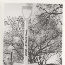 Black and white photo "Bob Robinson and John Martin Smith" standing in front of a giant shovel