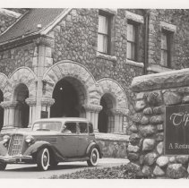 Black and white photo of a 1936 Auburn 654 in front of Tippecanoe Place