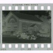 Filmstrip of Cord 812 Custom Sedan in front of Eckhart Public Library.