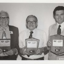 Black and white photo of three men with their ACD awards