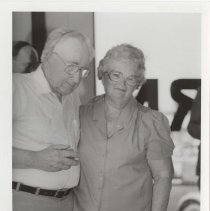 Black and white photo of a man and a woman in the Auburn Cord Duesenberg Automobile Museum