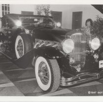 Black and white photo of a Duesenberg Model J phaeton
