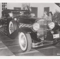 Black and white photo of 1935 Duesenberg Model SJ-582 torpedo phaeton
