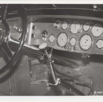 Black and white photo of the dashboard and interior of 1935 Duesenberg Model SJ-582 torpedo phaeton
