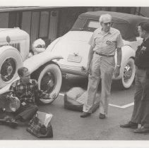Men performing maintenance on an ACD car