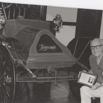 Mearl Bisel next to the Zimmerman he donated to the museum
