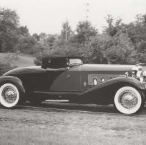 1931 Duesenberg Model J-465 speedster by Figoni in a grassy field