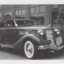 1936 Auburn 852 phaeton driving in front of the museum