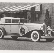 1932-1933 Auburn V-12 phaeton with the top up in front of The Filling Station