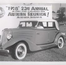 1934 Auburn phaeton in front of a 1978 23rd annual ACD Club Reunion banner