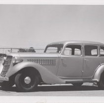 Side view of a 1936 Auburn 654 sedan in a parking lot
