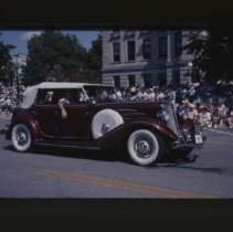 1934 Auburn Phaeton driving down Main Street
