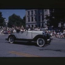 1928 - 1930 Auburn Cabriolet driving down Main Street