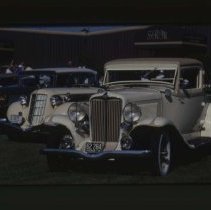 1932 Auburn Coupe in front of 1935 - 1936 Auburn